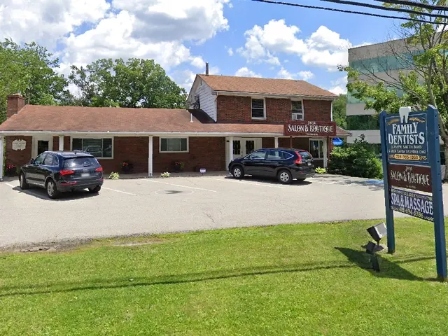 The practice at 2560 Brandt School Road, with the Family Dentists sign naming Dr. Joseph Smith and Dr. Karen Smith Saundry.